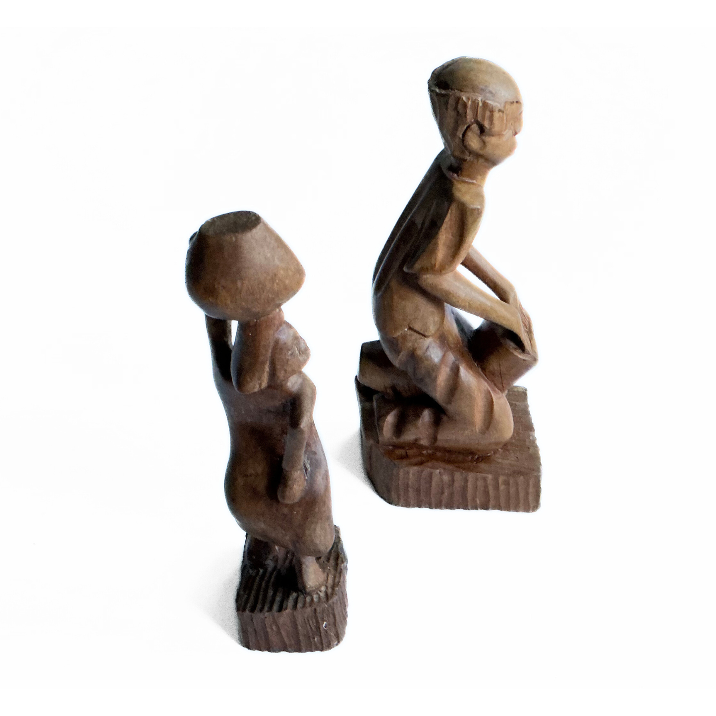 A pair of wooden carved African tribal statue. Drummer and basket carrier. 