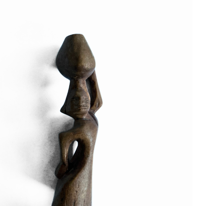 A pair of wooden carved African tribal statue. Drummer and basket carrier. 