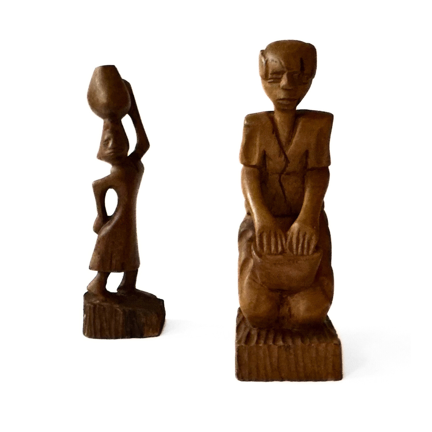 A pair of wooden carved African tribal statue. Drummer and basket carrier. 
